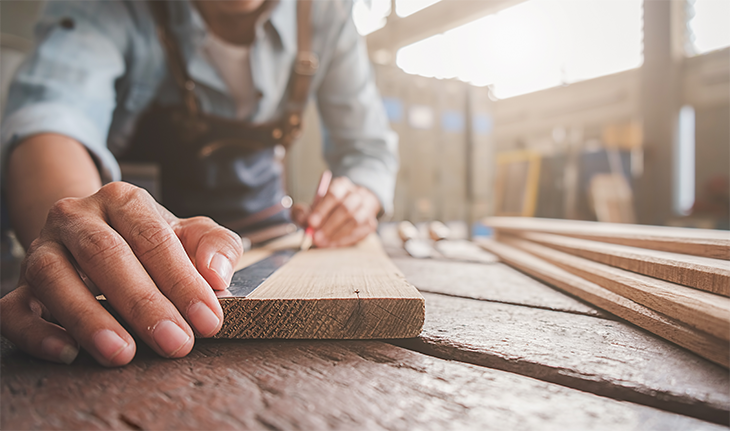 Cutting a piece of a wood plank